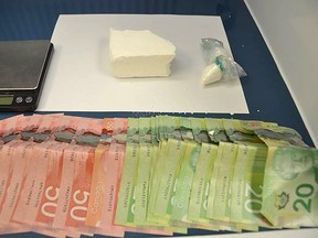 Supplied
Chatham-Kent police provided this photo of cocaine and fentanyl along with cash and scales that were seized during search warrants executed at two Chatham locations on Wednesday. Seven people are facing drug charges.