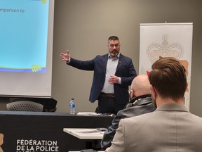 Officer Jeff McGowan, director with the National Police Federation, addresses community members at the Leduc Rec Centre, about the union’s Keep Alberta RCMP campaign, February 14. (Dillon Giancola)