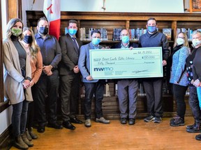 A $50,000 donation to Bruce County Public Library from the Nuclear Waste Management Organization was celebrated recently at the Teeswater branch. On hand were, from left: NWMO officials  Chloe Reaburn, Nikole Hagerman, Michael Pahor, Paul McGrath, Tareq Al-Zabet, South Bruce Mayor Robert Buckle, Library Board Chair/Saugeen Shores Mayor Luke Charbonneau, Library Director Brooke Mclean, Library Board Trustees Sheila Barker and Catherine Dickison. [Submitted]
