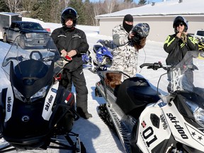 Mike Lewis, Cory Burke and Dan Morin prepare to start their Snowarama ride at Algoma Rod and Gun Club on Saturday morning. BRIAN KELLY