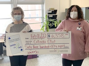 Collinda Elliot, left, receives the Catch the Ace 3.0 week 30 weekly prize of $6,358 from Pembroke Regional Hospital Foundation community fundraising specialist Leigh Costello.