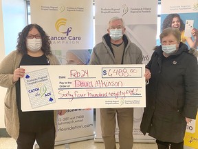 Pembroke Regional Hospital Foundation community fundraising specialist Leigh Costello, left, presents Week 31 winner for Catch the Ace 3.0 David Atkinson and wife Marjolaine with their prize of $6,488. Submitted photo