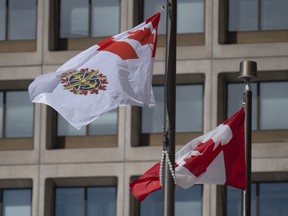 The Canadian Forces flag flies outside office buildings in Ottawa on Mar. 9, 2021. THE CANADIAN PRESS/Adrian Wyld