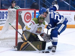 Marc Boudreau of the Sudbury Wolves tries to get the puck past North Bay Battalion goalie Joe Vrbetic during OHL action from the Sudbury Community Arena on Sunday afternoon.