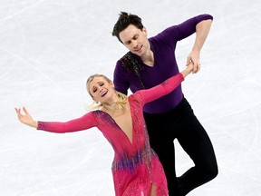 Kirsten Moore-Towers and Michael Marinaro of Team Canada skate in the pairs' short program team event during the Beijing 2022 Winter Olympic Games at Capital Indoor Stadium on Feb. 4, 2022, in Beijing, China. (Photo by Justin Setterfield/Getty Images)