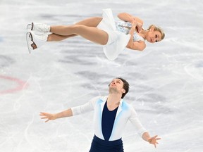 Kirsten Moore-Towers and Michael Marinaro of Canada compete during the pairs' free skate at the Beijing 2022 Winter Olympic Games at Capital Indoor Stadium on Feb. 19, 2022, in Beijing, China. (Photo by Justin Setterfield/Getty Images)
