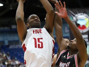 Jachai Taylor of the Windsor Express tries to stop Zena Edosomwan of the Sudbury Five from taking a shot during NBL action from the Sudbury Community Aena on Monday afternoon.