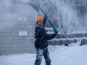 Jay Hansen shovelling snow during the Kenora's first significant weather event on Jan. 18.