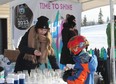 A volunteer at a pop-up winter carnival promoting the 2023 Wood Buffalo Arctic Winter Games. Jenna Hamilton/Fort McMurray Today/Postmedia Network