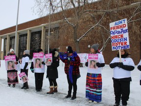 Protesters rally outside the Fort McMurray court house in support of Sherri Lynn Flett, who was found murdered in January. The rally took place as Timothy Andrew McDougall, who is charged with second degree murder, appeared in court on Monday, February 28, 2022. Vincent McDermott/Fort McMurray Today/Postmedia Network