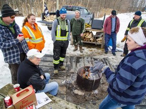 People who left 20 farm vehicles parked on Highway 402 between Feb.  9 and Feb.  14, 2022, set up a camp on land adjacent to the highway at Forest Road in Lambton County.  (Derek Ruttan/The London Free Press)