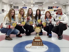 Lauren Miller (from left to right), Myla Plett, Rachel Jacques, Alyssa Nedohin, Chloe Fediuk, and Blair Lenton take a celebratory group photo on the ice at the Hinton Curling Club following the U18 Optimist Championship. After winning gold at the tournament, Team Plett is representing Alberta on the national stage in Oakville, Ont. in May.