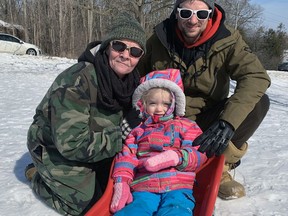 Jackie Murphy joins her son, Spencer, and granddaughter Everleigh, 2 1/2, for tobogganing on a hill on the First Concession in Waterford, near Waterford Deer Park. They were among a number of people who got outdoors to enjoy the sunny weather on Family Day. Vincent Ball