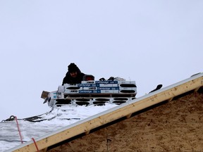 Mike Lackey, of Superior Contracting, works on the roof of a home under construction on Webster Crescent on Friday afternoon. (RONALD ZAJAC/The Recorder and Times)