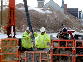 Workers with Maurice's Masonry and Forming pour concrete as a senior's apartment complex begins to take shape on the site of the former St. Vincent de Paul Hospital in Brockville on Wednesday afternoon. (RONALD ZAJAC/The Recorder and Times)