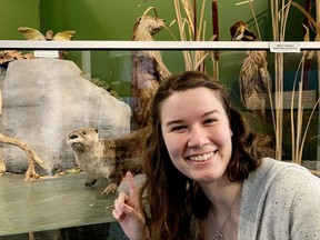 Samantha Allison points to an otter display. Otters are one of the animals Allison talks about during one of her educational videos for kindergarten students through the Sara Saves program. (SUBMITTED PHOTO)