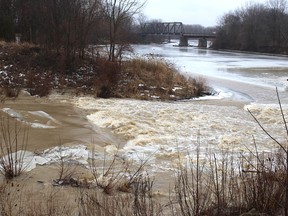 Water from the McGregor Creek Diversion Channel swiftly flows into the Thames River on the east side of Chatham on Thursday. The water level on McGregor Creek prompted the Lower Thames Valley Conservation Authority to implement the flood control measure. PHOTO Ellwood Shreve/Chatham Daily News