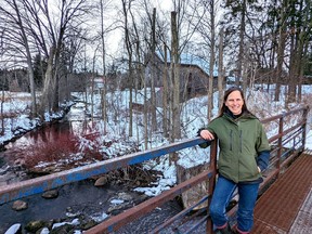 Retired teacher Kendra Martin stands on the dam at the Harrington Pond, behind the Harrington Grist Mill, one of two locations where she will be running her new Coyote Nature School for local kids between the ages of six and 10. Galen Simmons/Postmedia Network
