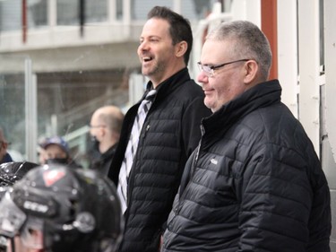 Cornwall coaches Rick Hutt (left) and Mitch Gagne, during happier times in Sunday's game, before things fell apart against the Mustangs. Photo on Sunday, February 6, 2022, in Cornwall, Ontario. Todd Hambleton/Standard-Freeholder/Postmedia Network
