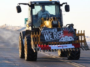 A tractor crossing a Highway 417 overpass into the municipality of Prescott-Russell. Photo on Saturday, February 5, 2022. Todd Hambleton/Standard-Freeholder/Postmedia Network