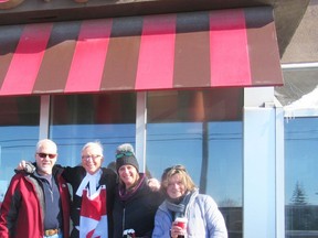 Maurice Gatien during a coffee stop Sunday morning in Leitrim near Ottawa, with friends and supporters from New Mexico joining him for the walk, (from left) Alton Donnell, his daughter Ashley and wife Carolyn (originally of Cornwall).Handout/Standard-Freeholder/Postmedia Network