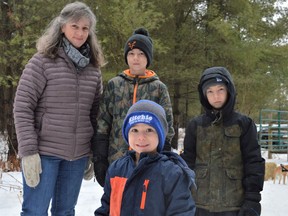 From left, Shelley Godard, Titus Karpowich, Leeland Karpowich, and Finn Karpowich (front) put on some snowshoes and hiked the Warwick Forest as part of SNC's 75th anniversary event on Saturday February 12, 2022 in Berwick, Ont. Shawna O'Neill/Cornwall Standard-Freeholder/Postmedia Network