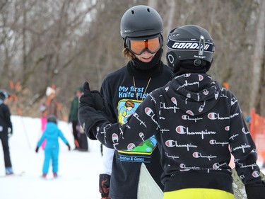 Snowboarder Nick Laplante chatting with a friend after a snowboarding run. Photo on Monday, February 21, 2022, in Cornwall, Ontario.Todd Hambleton/Standard-Freeholder/Postmedia Network