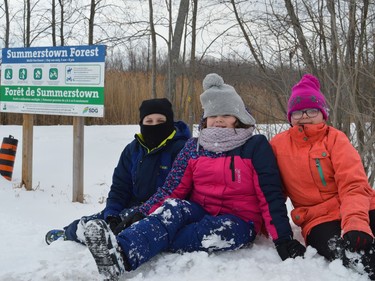 From left to right, Jordan Boisvenue, Selena Boisvenue, and Jersey Crawford waiting for the first Skifest at the Summerstown Trails to begin on Sunday February 27, 2022 in Summerstown, Ont. Shawna O'Neill/Cornwall Standard-Freeholder/Postmedia Network