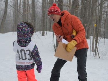 Skifest organizer (right) René Sauvé encouraging a participant in the six-years-old and under category on Sunday February 27, 2022 in Summerstown, Ont. Shawna O'Neill/Cornwall Standard-Freeholder/Postmedia Network