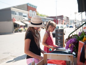 Handout/Cornwall Standard-Freeholder/Postmedia Network
A Gina Dragone Photography photo taken in 2019 of two younger shoppers on Main Street in Alexandria.