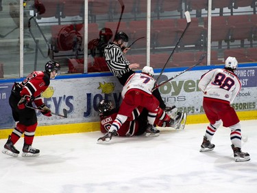 Cornwall Colts Nolan Gagnon took Kemptville 73's Brock Krulicki into the boards during play, taking out the linesman too, on Thursday February 17, 2022 in Cornwall, Ont. The Colts lost 3-2. Robert Lefebvre/Special to the Cornwall Standard-Freeholder/Postmedia Network