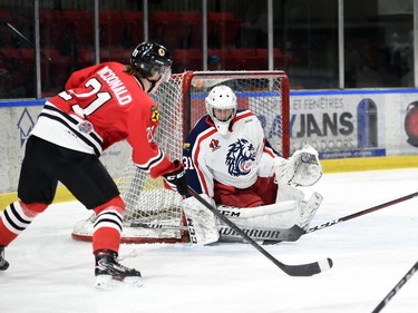 Brockville Braves Jack McDonald lines up for a shot at Cornwall Colts goaltender Emile Savoie during play on Monday February 21, 2022 in Cornwall, Ont. The Colts lost 4-2. Robert Lefebvre/Special to the Cornwall Standard-Freeholder/Postmedia Network