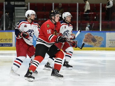 Brockville Braves Lucas Culhane, between two Cornwall Colts players during play on Monday February 21, 2022 in Cornwall, Ont. The Colts lost 4-2. Robert Lefebvre/Special to the Cornwall Standard-Freeholder/Postmedia Network