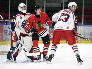 Brockville Braves Owen Rainey is sandwiched by Cornwall Colts goaltender Dax Easter and John Richer during play on Thursday February 3, 2022 in Cornwall, Ont. The Colts lost 5-2. Robert Lefebvre/Special to the Cornwall Standard-Freeholder/Postmedia Network