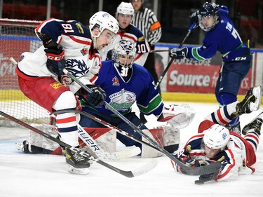 Cornwall Colts Kobe Tallman (No. 81, left) gets a stick on the puck in front of a prone Braden Bowen in front of Hawkesbury Hawks goaltender Matthew Tovell's crease on Thursday February 10, 2022 in Cornwall, Ont. The Colts lost 6-2. Robert Lefebvre/Special to the Cornwall Standard-Freeholder/Postmedia Network