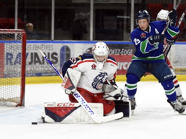 Cornwall Colts goaltender Dax Easter with a pad save as Hawkesbury Hawks Josh Spratt tries to get at the rebound during play on Thursday February 10, 2022 in Cornwall, Ont. The Colts lost 6-2. Robert Lefebvre/Special to the Cornwall Standard-Freeholder/Postmedia Network