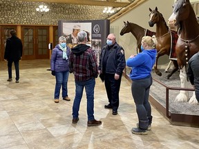 Alberta Health Services’ EMS operations rep Randy Bryksa speaks with members of the public in the RancheHouse lobby following a February 7 presentation to council. Patrick Gibson/Cochrane Times