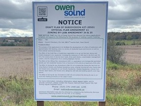 An example of a posting at a development site with a QR code, in the upper left corner.