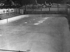 The interior of Queen's University's Jock Harty Arena II on Arch Street. The rink was demolished in 1968 to make room for Humphrey Hall. The large time clock at the far end was relocated to the old Harold Harvey Arena.