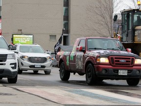 A "freedom convoy" drives by City Hall in Kingston on Feb. 21.