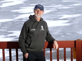 James Malcolm, who is retiring and selling his part of the outdoor equipment store Trailhead, behind his house on the St. Lawrence River on Feb. 11.