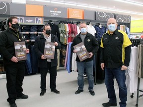 Giant Tiger managers Darryl Skinner (Algonquin Avenue), Sean Wilson (Lakeshore Drive) and Rob Rowlandson (Sturgeon Falls) display the plaques they received from John Strang recognizing the stores' assistance in the Ride for Dad.
PJ Wilson/The Nugget
