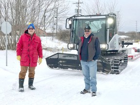 In the photo from left, Pembroke Councillor Brian Abdallah and Timberline Snowmobile Club President Kerry MacDonald.