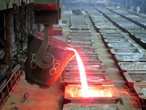 Molten nickel is poured at the Norilsk Nickel company in the Arctic city of Norilsk January 23, 2015.  REUTERS/Polina Devitt/File Photo