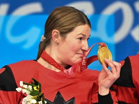 Gold medallist Canada's Ella Shelton, from Ingersoll, celebrates with teammates during the victory ceremony at the end of the women's gold-medal match of the Beijing 2022 Winter Olympic Games ice hockey competition between Canada and USA at the Wukesong Sports Centre in Beijing on Feb. 17, 2022.