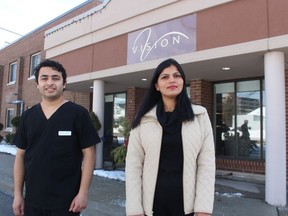 Lambton College international students Jai Rawal, left, and Gagandeep Kaur stand outside of Vision Nursing and Rest Home in Sarnia where they live and work.