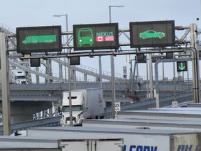 Trucks enter Canada from Michigan Sunday morning on the Blue Water Bridge near Sarnia.
Paul Morden/The Observer