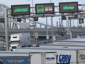 Trucks enter Canada from Michigan Sunday morning on the Blue Water Bridge near Sarnia.