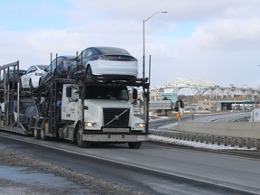 An eastbound transport truck enters Highway 402 Saturday from the Blue Water Bridge.