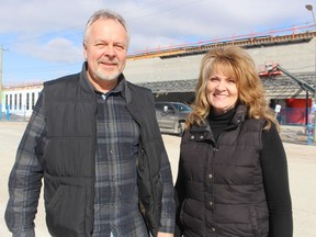 George and Rhonda Noll, co-chairpersons of a fundraising campaign for the East Lambton Community Complex, stand near the building now under construction in Watford. The campaign is working to raise $2 million for the project.